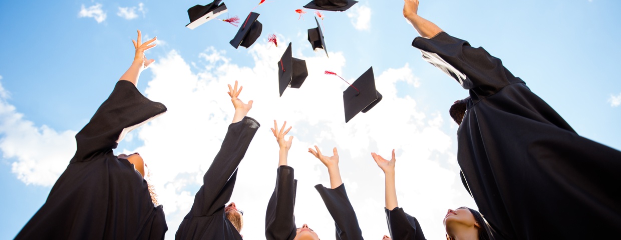 graduates throwing caps after graduating online high school early