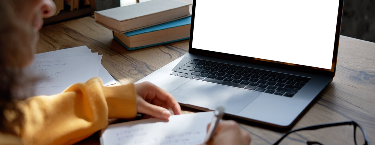 student smiling while prepping for online test