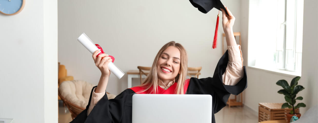 Happy student on her online graduation day at home