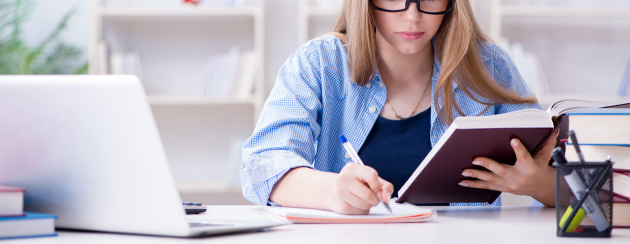 Teenage girl doing her online school homework